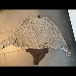 Out from under winged bodysuit